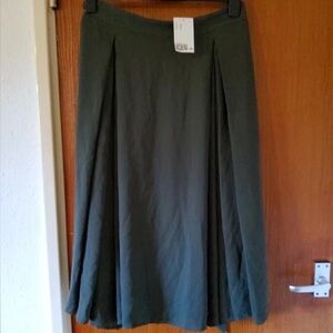 Green skirt with tags still on